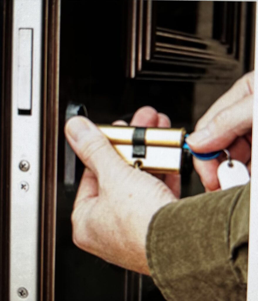 Locksmith changing a profile cylinder